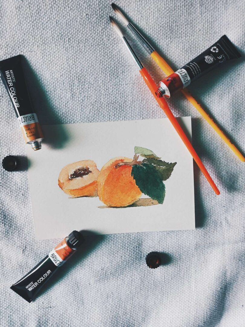 Water colors and brushes on papaya painting paper